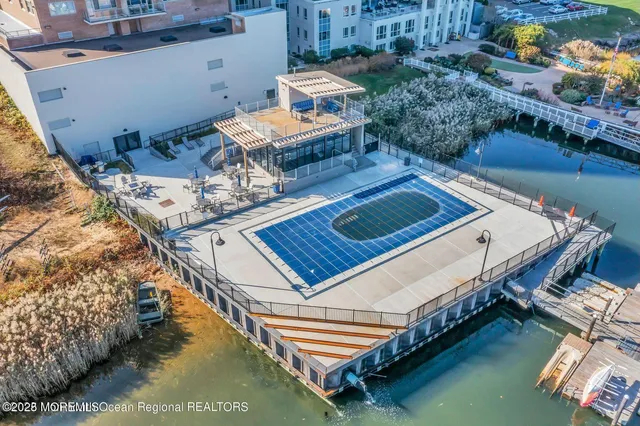 a view of a balcony with two chairs and a table