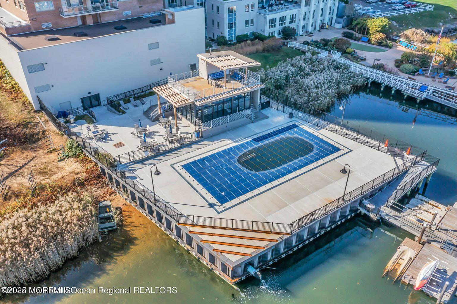 28 Riverside Avenue, Unit 1G Red Bank, NJ 07701 - Photo 19 of 25 a view of a balcony with two chairs and a table