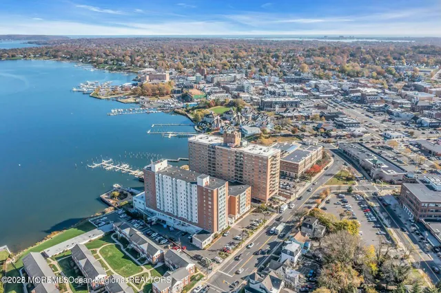 an aerial view of a house with a lake view