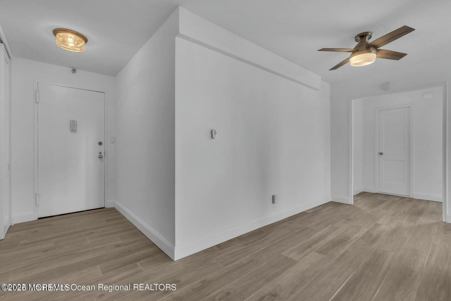 28 Riverside Avenue, Unit 1G Red Bank, NJ 07701 - Photo 10 of 25 wooden floor in an empty room
