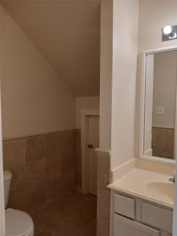 a view of room with a chair and front door