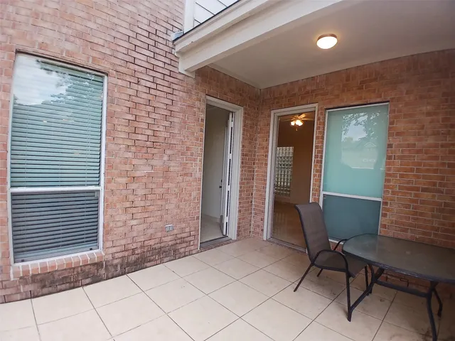 a view of a backyard with a tree