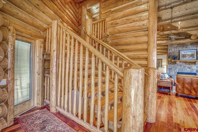 a bedroom with a bed and glass walk in closet