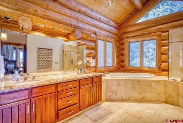 a bathroom with a bathtub and shower