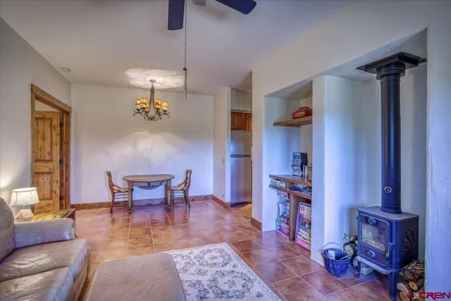 a kitchen with stainless steel appliances granite countertop a refrigerator and a stove