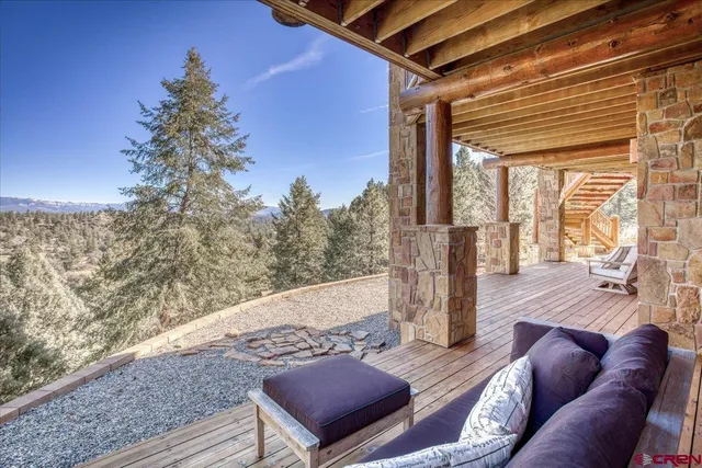 a view of a house with a yard and garage