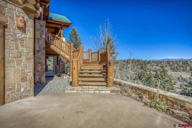 a view of a house with a snow in the yard