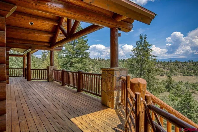 a view of a balcony with wooden floor