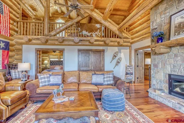 a view of a living room with a bed and a rug