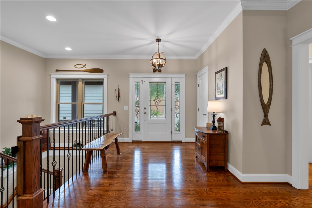 329 High Hampton Road Salem, SC 29676 - Photo 18 of 47 Gleaming hardwood floors and classic crown molding welcome guests into this light-filled entryway.