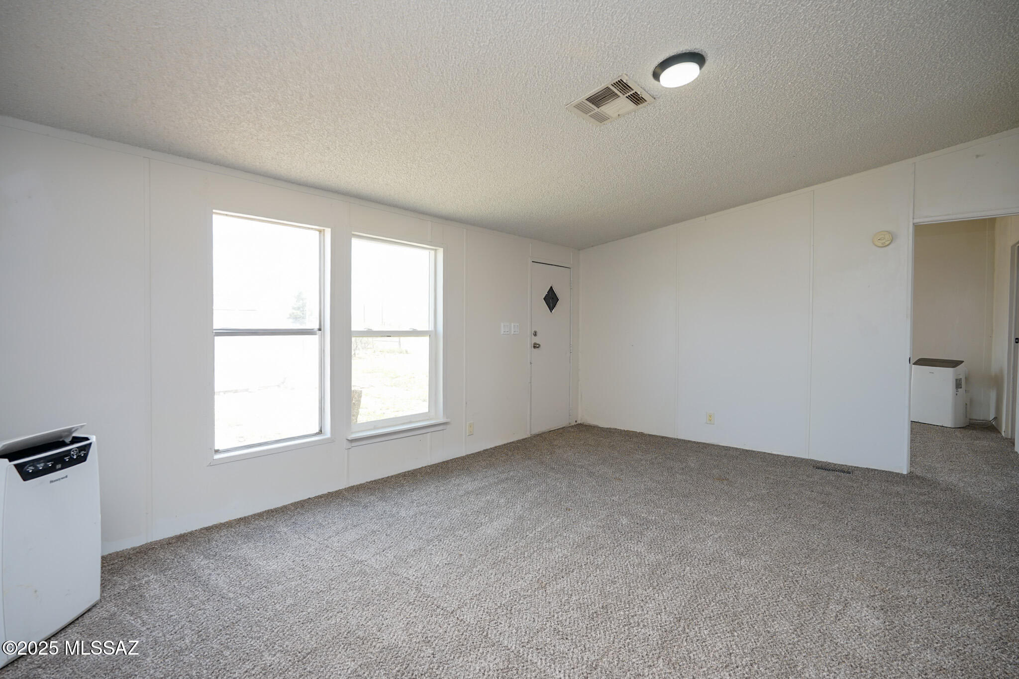 5188 East Phillips Road Willcox, AZ 85643 - Photo 3 of 43 an empty room with windows