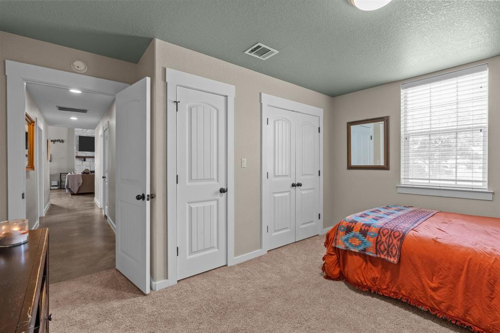 395 Private Road 4219 Decatur, TX 76234 - Photo 23 of 29 a bedroom with a bed and a window