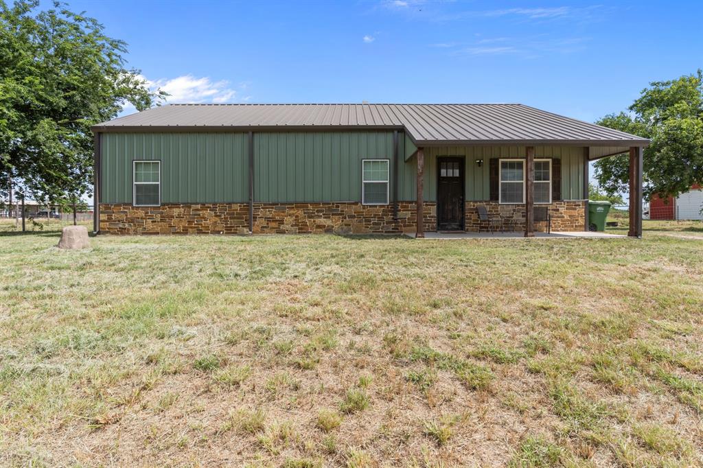 395 Private Road 4219 Decatur, TX 76234 - Photo 3 of 29 a front view of a house with a garden