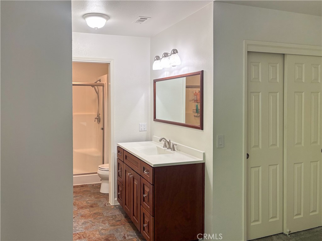 4125 Tranquilla Avenue Atascadero, CA 93422 - Photo 11 of 27 a bathroom with a sink a mirror and a toilet