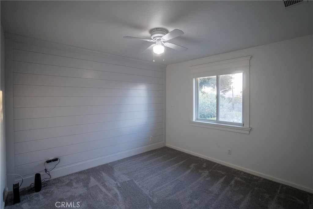 4125 Tranquilla Avenue Atascadero, CA 93422 - Photo 12 of 27 an empty room with a window and a fan