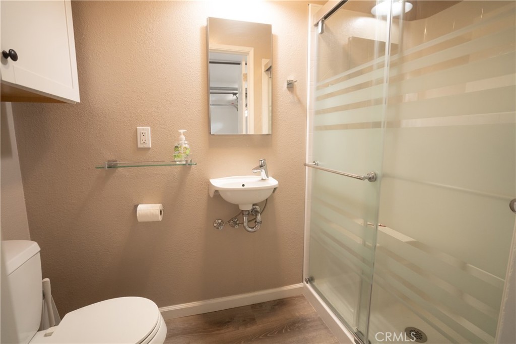 4125 Tranquilla Avenue Atascadero, CA 93422 - Photo 25 of 27 a bathroom with a toilet and a shower