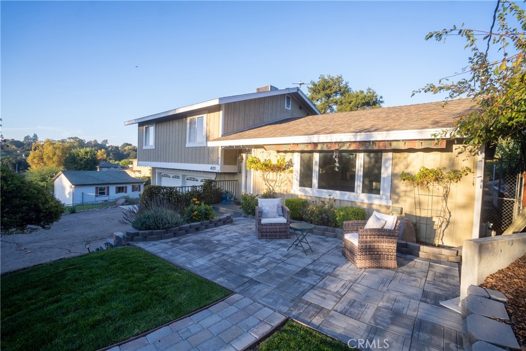 4125 Tranquilla Avenue Atascadero, CA 93422 - Photo 5 of 27 a view of a house with backyard sitting area and garden
