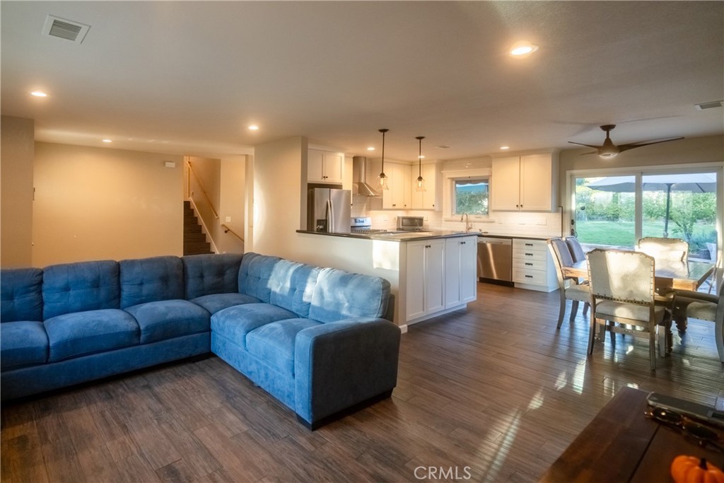 4125 Tranquilla Avenue Atascadero, CA 93422 - Photo 8 of 27 a view of a living room and kitchen with a large window