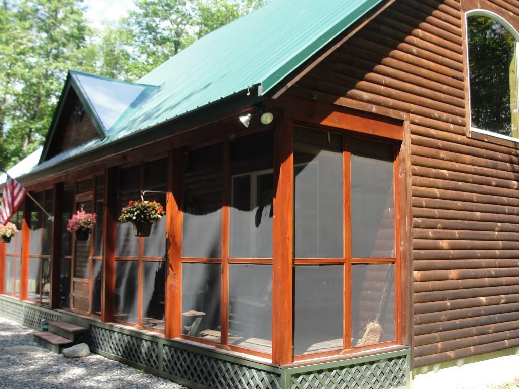 433 Sweden Road Bridgton, ME 04009 - Photo 3 of 21 Log sided and metal roof are in...