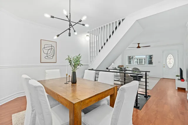 a view of a dining room with furniture and wooden floor