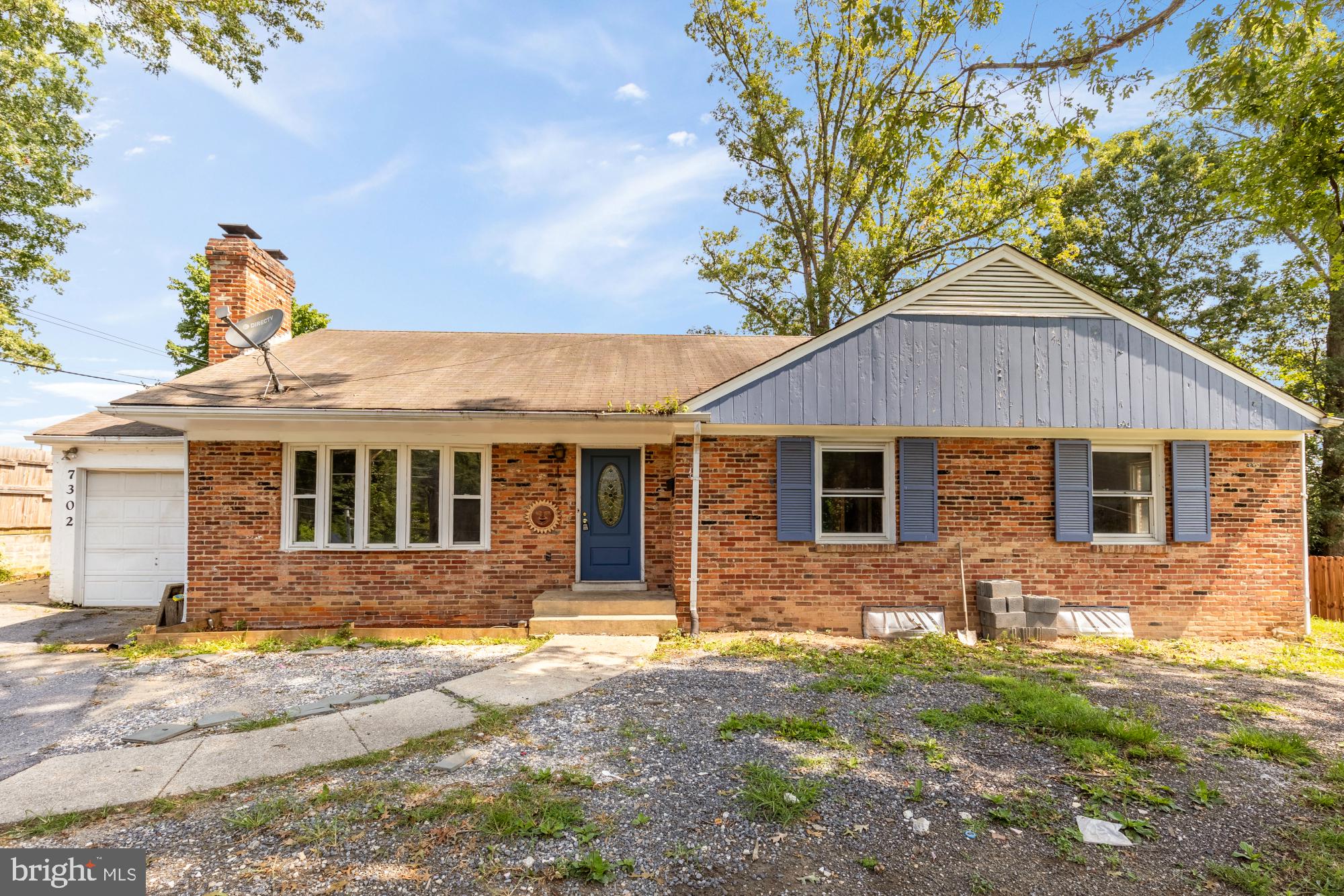 7302 Riverdale Road Lanham, MD 20706 - Photo 1 of 33 a front view of a house with yard
