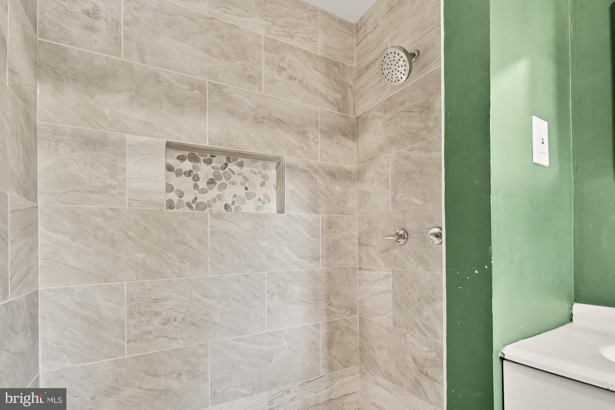 7302 Riverdale Road Lanham, MD 20706 - Photo 13 of 33 a bathroom with a shower