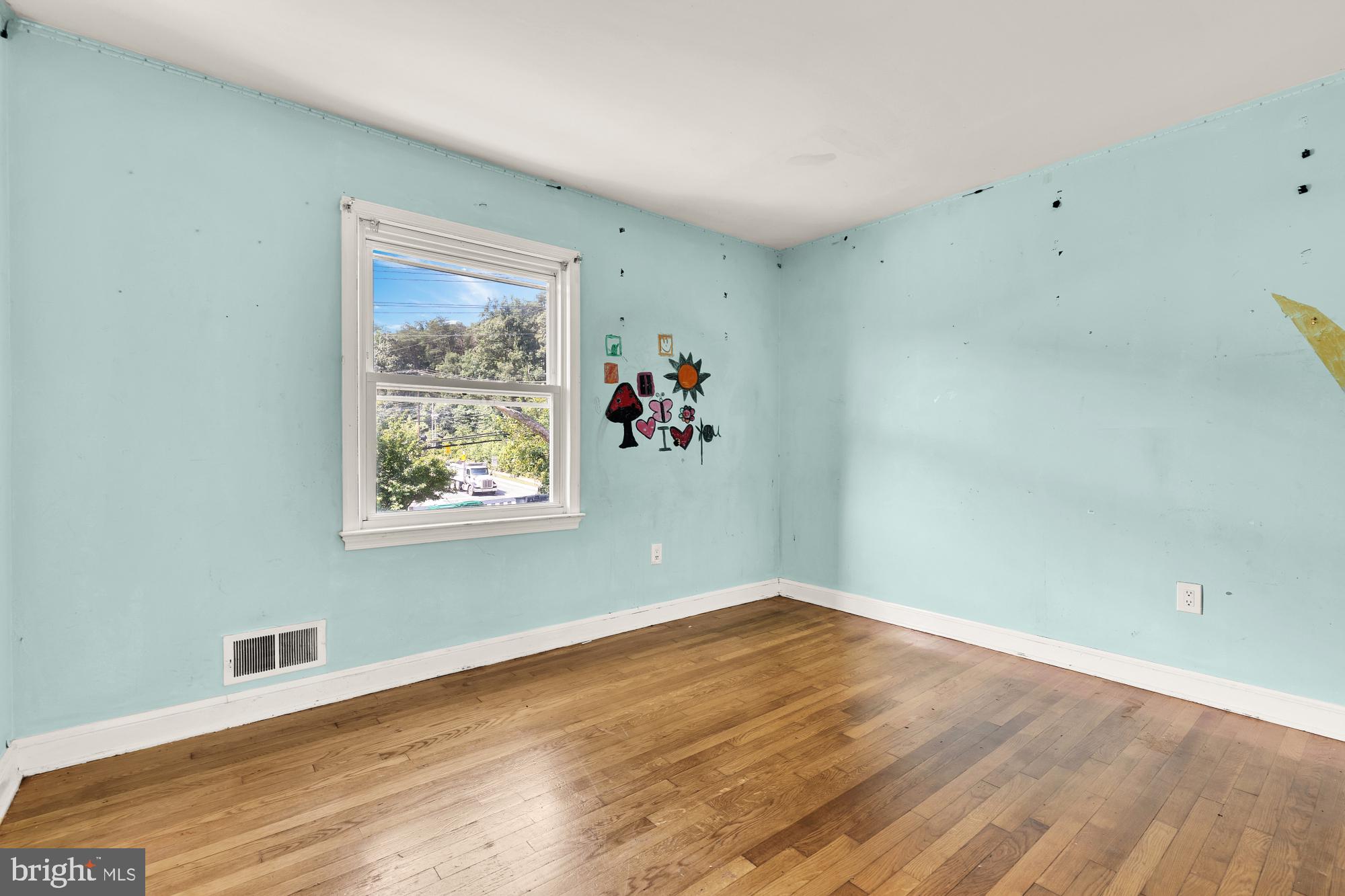 7302 Riverdale Road Lanham, MD 20706 - Photo 17 of 33 a view of a room with wooden floor and window