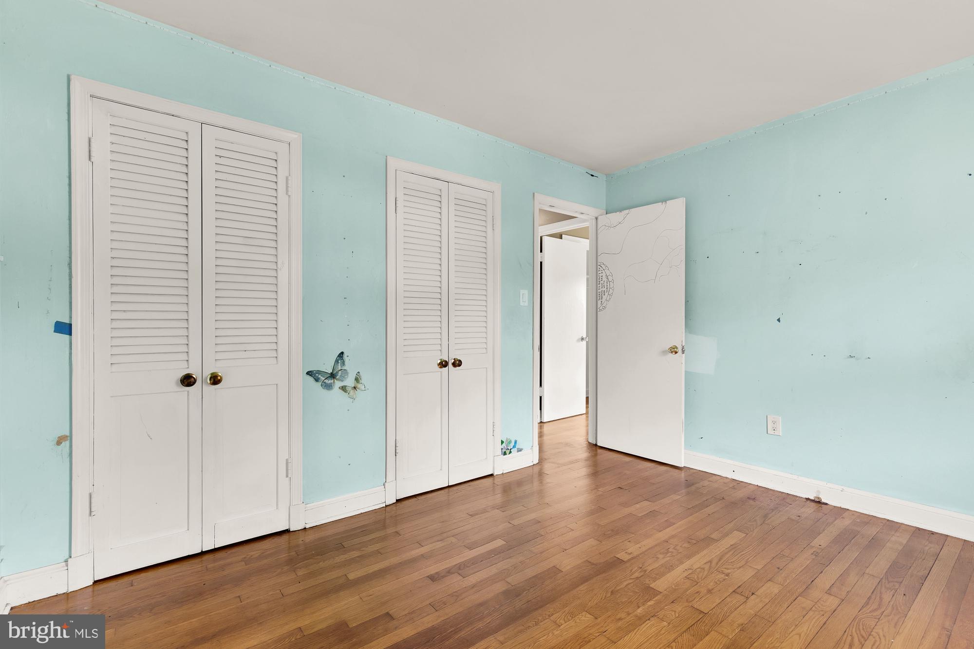 7302 Riverdale Road Lanham, MD 20706 - Photo 18 of 33 a view of an empty room with wooden floor and closet
