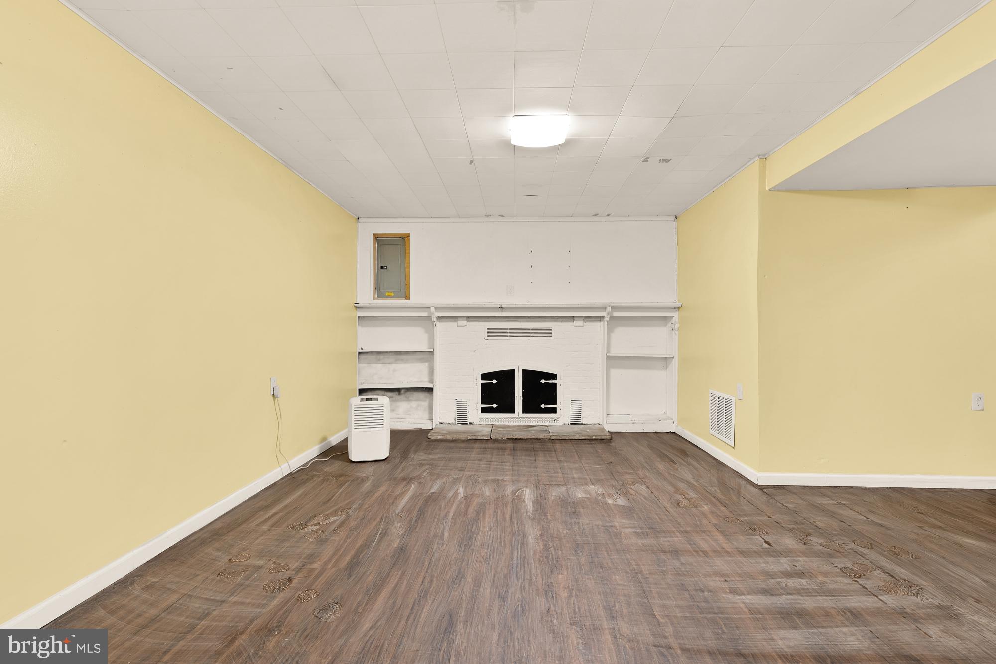 7302 Riverdale Road Lanham, MD 20706 - Photo 19 of 33 a view of a room with wooden floor and a fireplace
