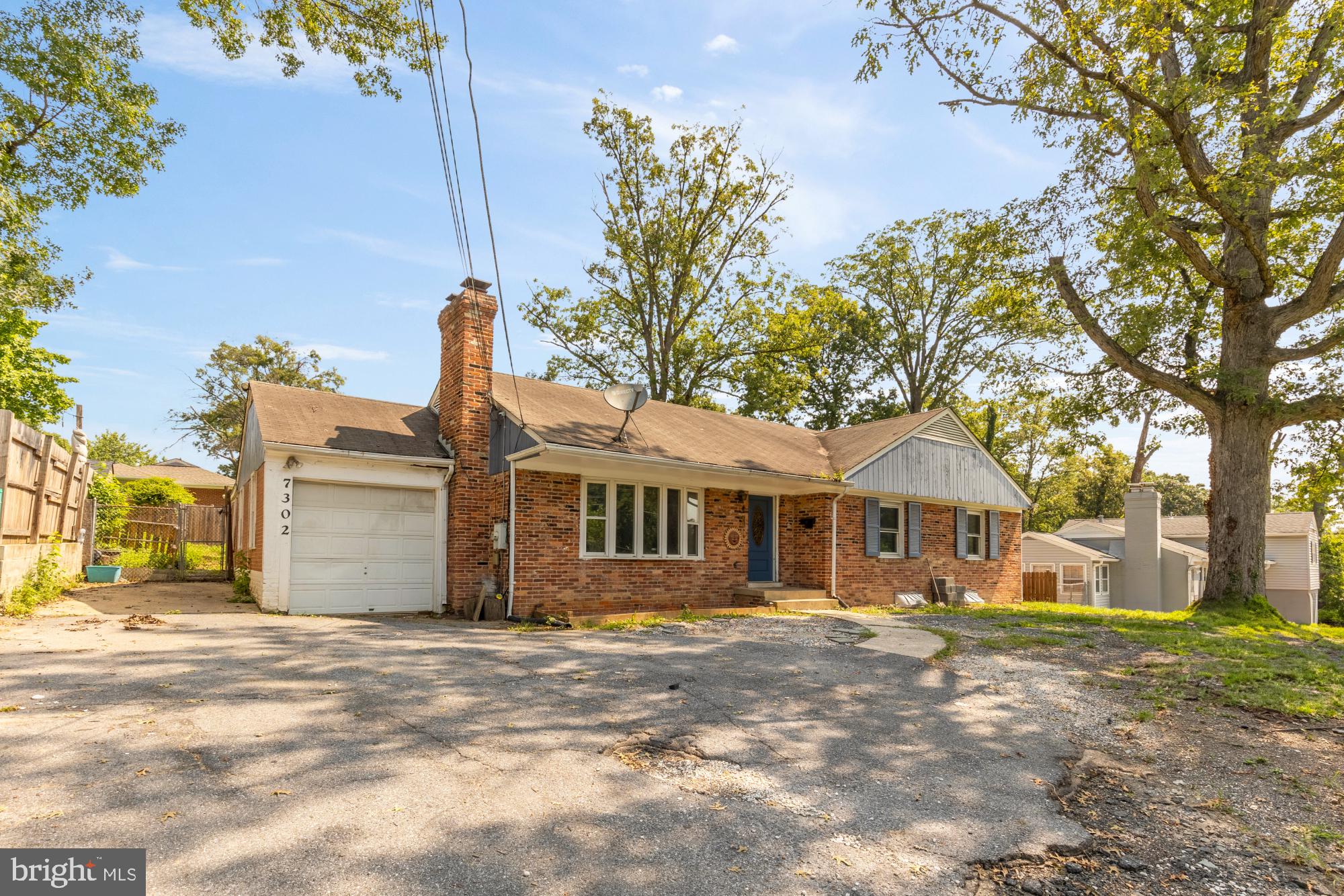 7302 Riverdale Road Lanham, MD 20706 - Photo 2 of 33 a front view of a house with a yard