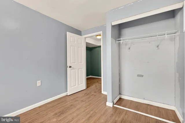 a view of room with wooden floor