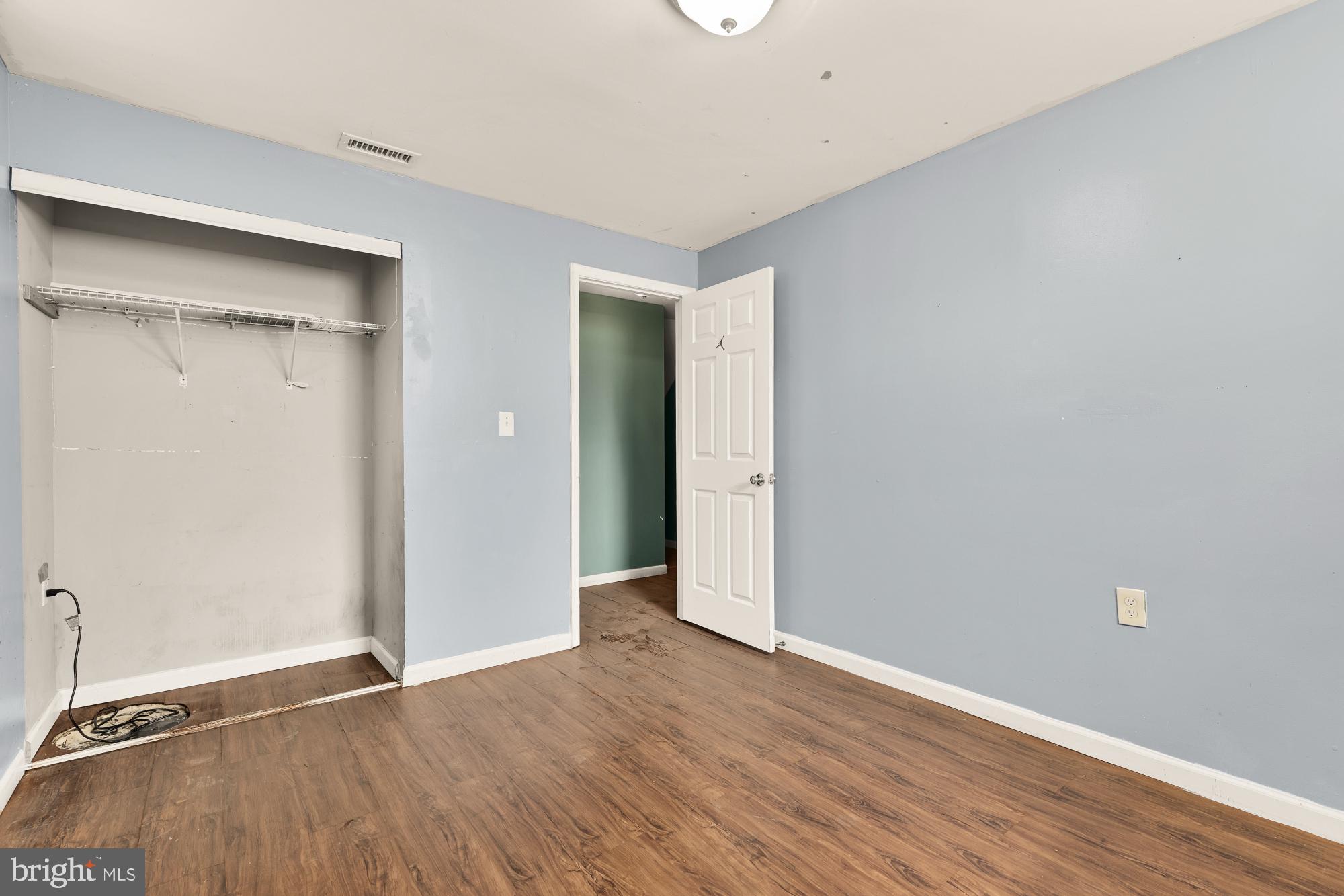 7302 Riverdale Road Lanham, MD 20706 - Photo 24 of 33 a view of an empty room with wooden floor