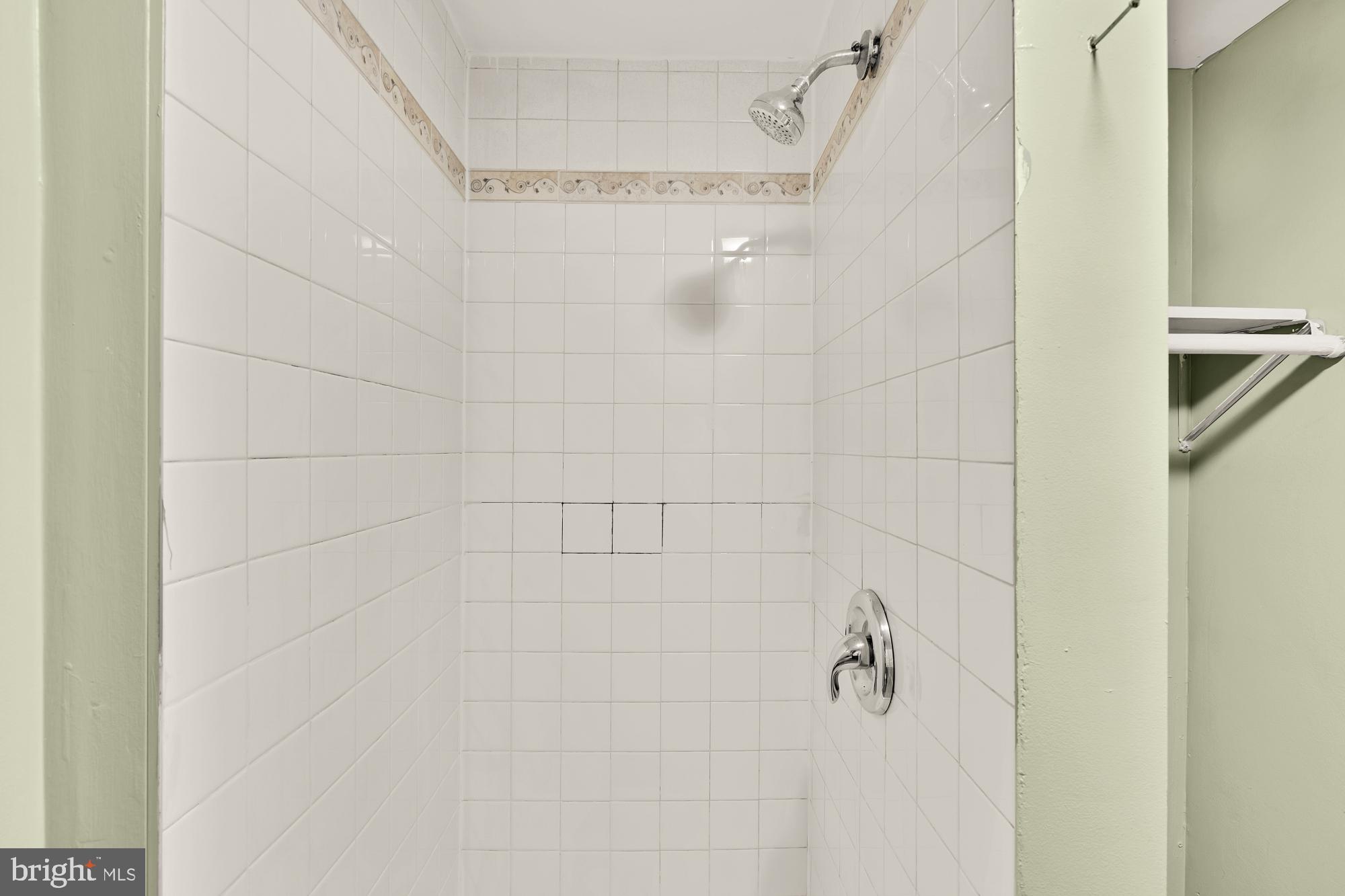 7302 Riverdale Road Lanham, MD 20706 - Photo 26 of 33 a bathroom with a shower