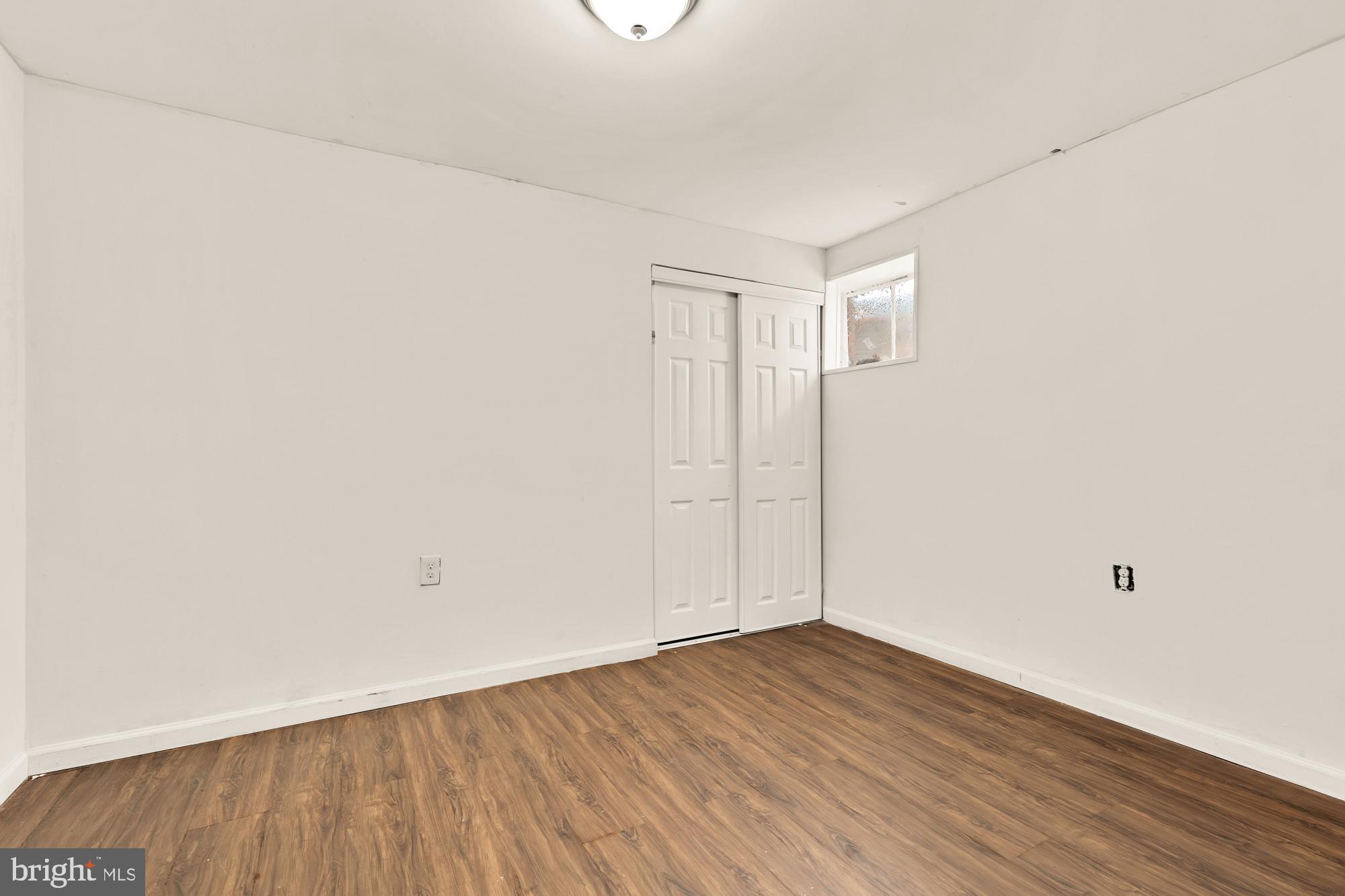 7302 Riverdale Road Lanham, MD 20706 - Photo 29 of 33 a view of an empty room with wooden floor