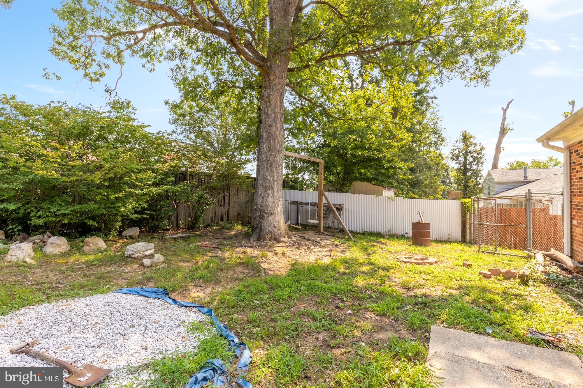 7302 Riverdale Road Lanham, MD 20706 - Photo 33 of 33 a backyard of a house with a large tree