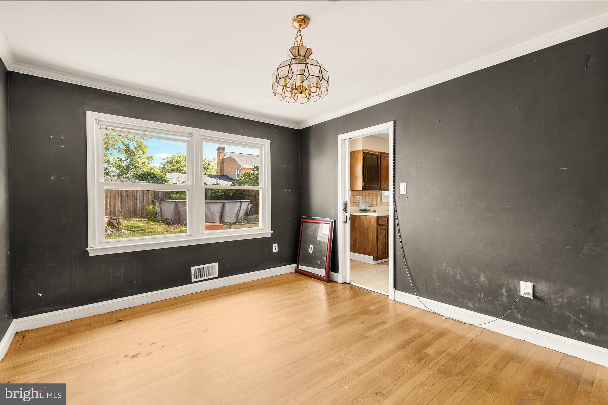 7302 Riverdale Road Lanham, MD 20706 - Photo 9 of 33 a view of an empty room with a window