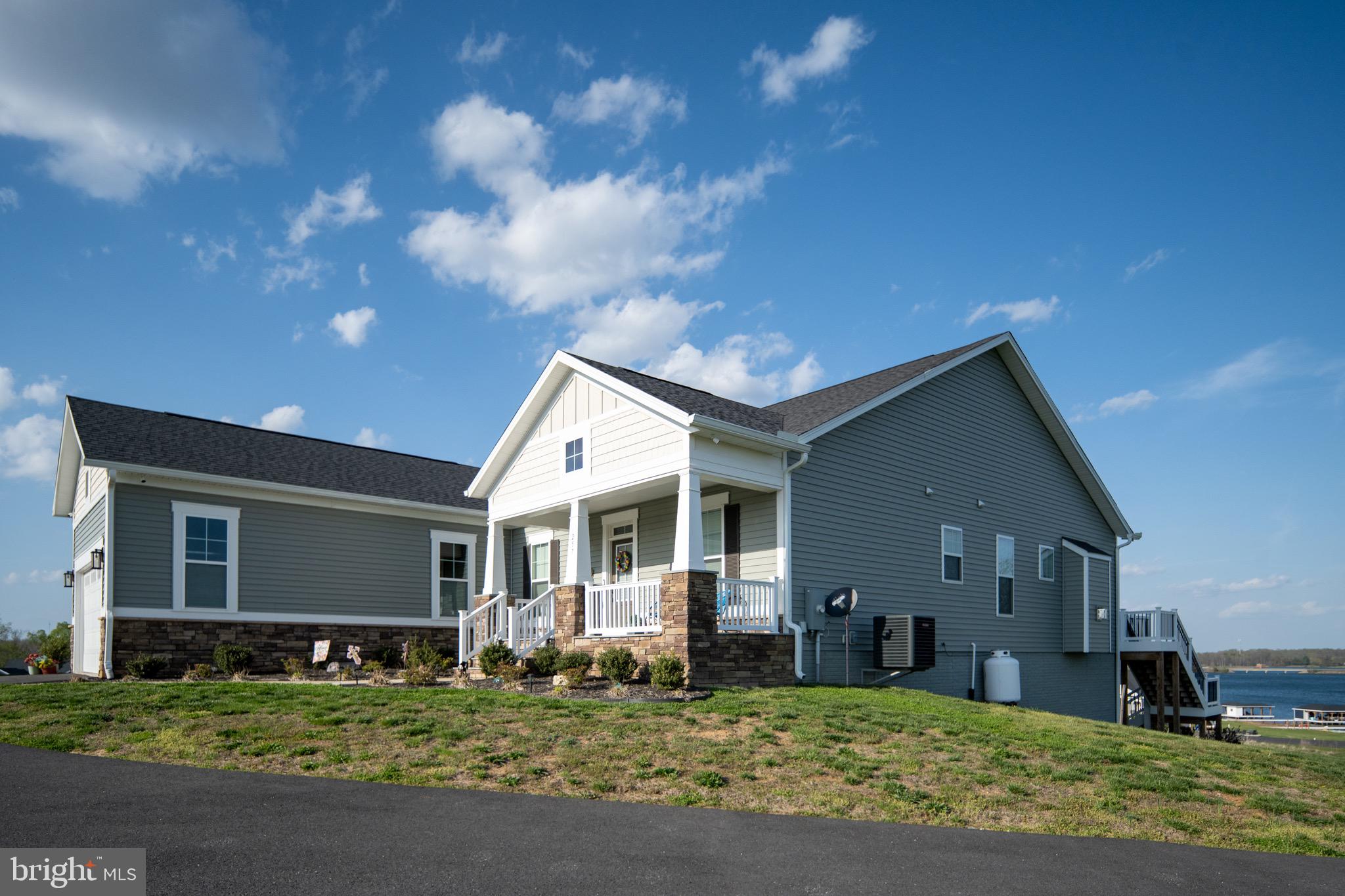 257 Rock Island Ridge Mineral, VA 23117 - Photo 15 of 128 a front view of a house with a yard