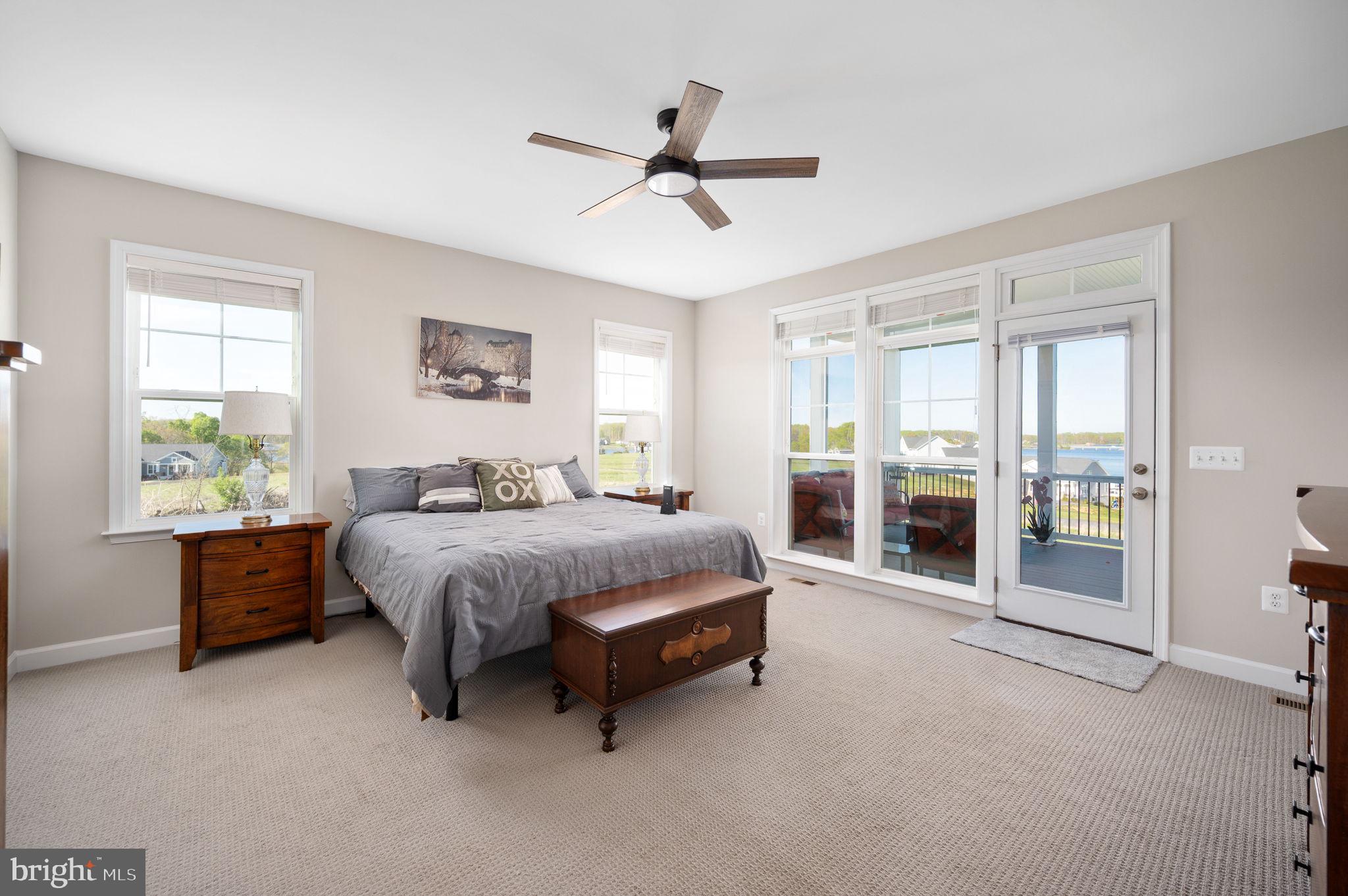 257 Rock Island Ridge Mineral, VA 23117 - Photo 56 of 128 a spacious bedroom with a bed and a chandelier