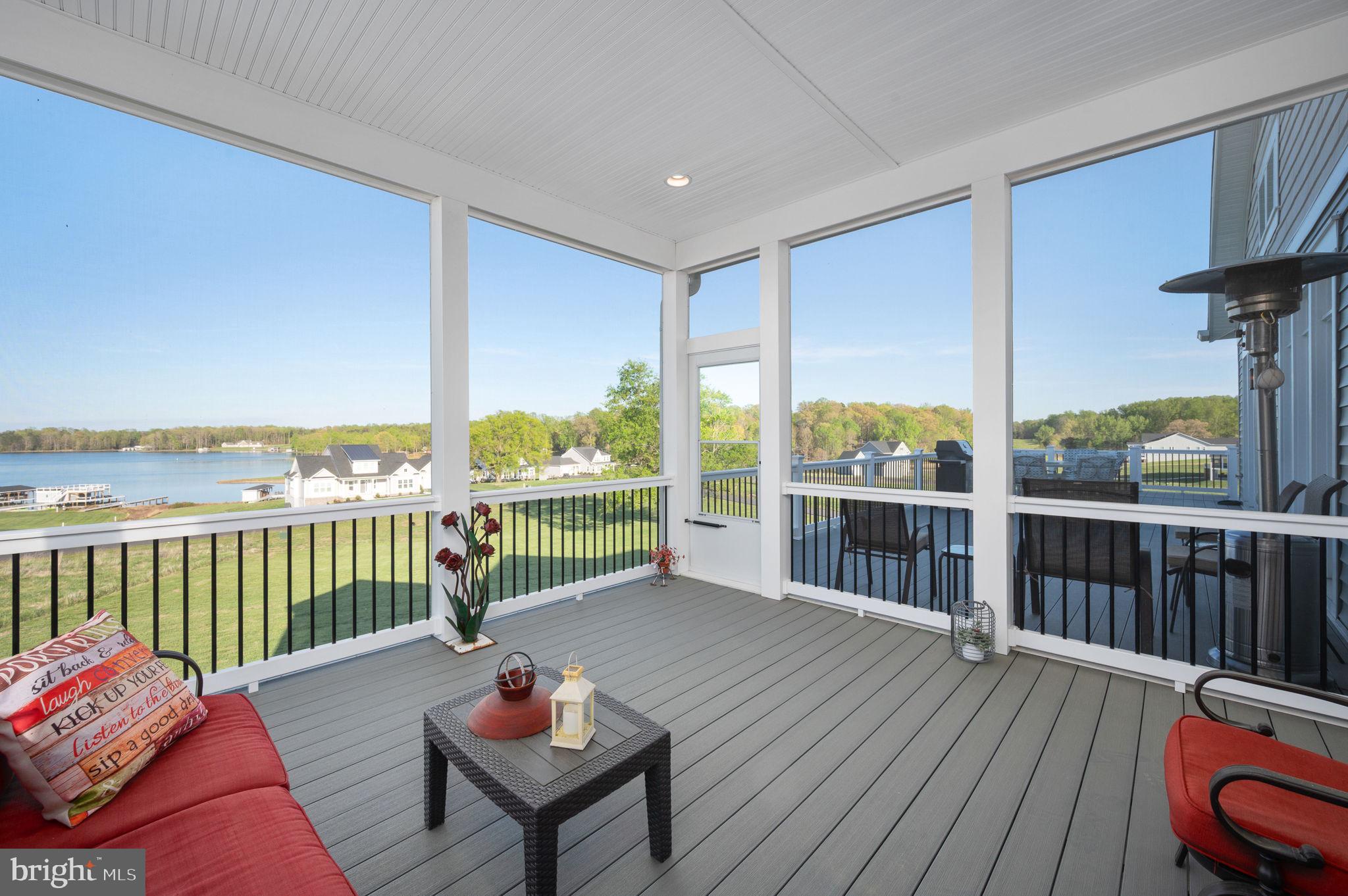 257 Rock Island Ridge Mineral, VA 23117 - Photo 60 of 128 a balcony with wooden floor table and chairs
