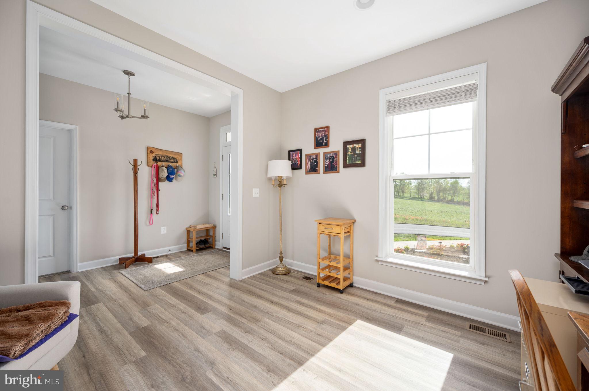 257 Rock Island Ridge Mineral, VA 23117 - Photo 74 of 128 a view of a livingroom with wooden floor and a window