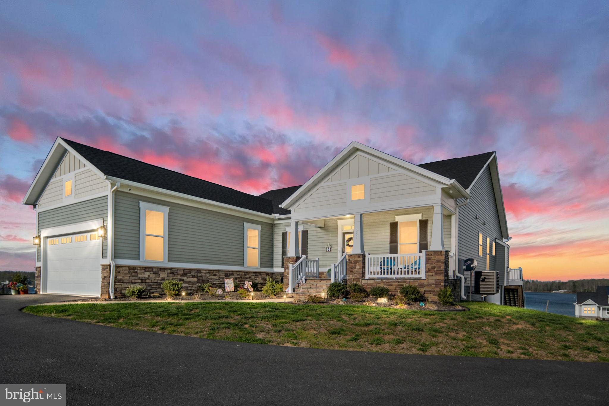 257 Rock Island Ridge Mineral, VA 23117 - Photo 8 of 128 a front view of a house with a yard and garage