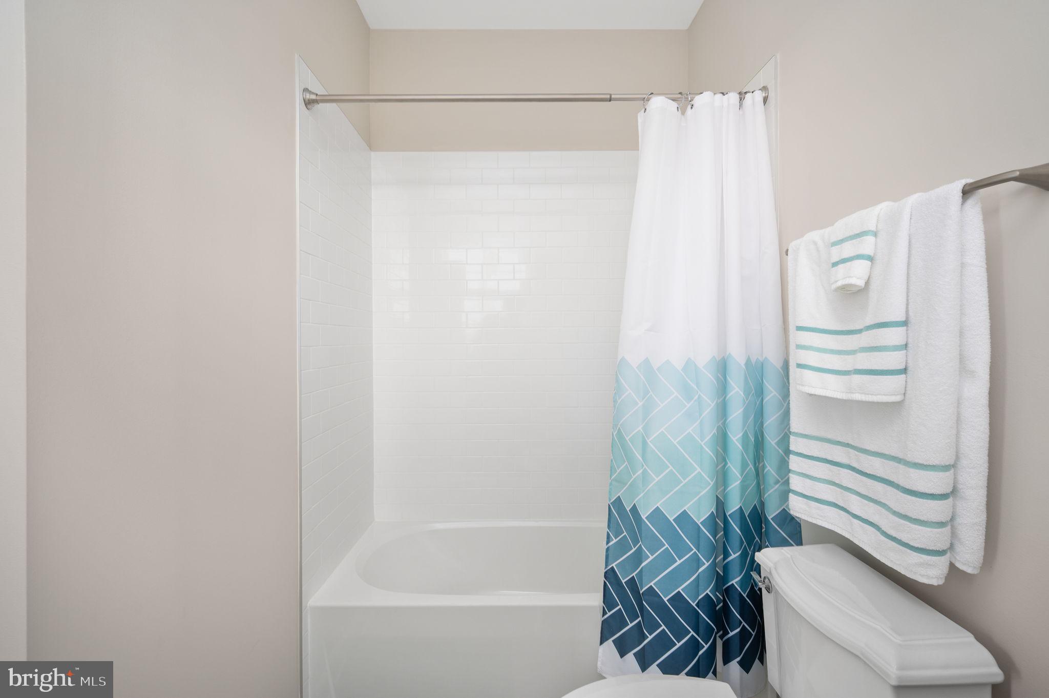 257 Rock Island Ridge Mineral, VA 23117 - Photo 84 of 128 a bathroom with a shower curtain and a sink