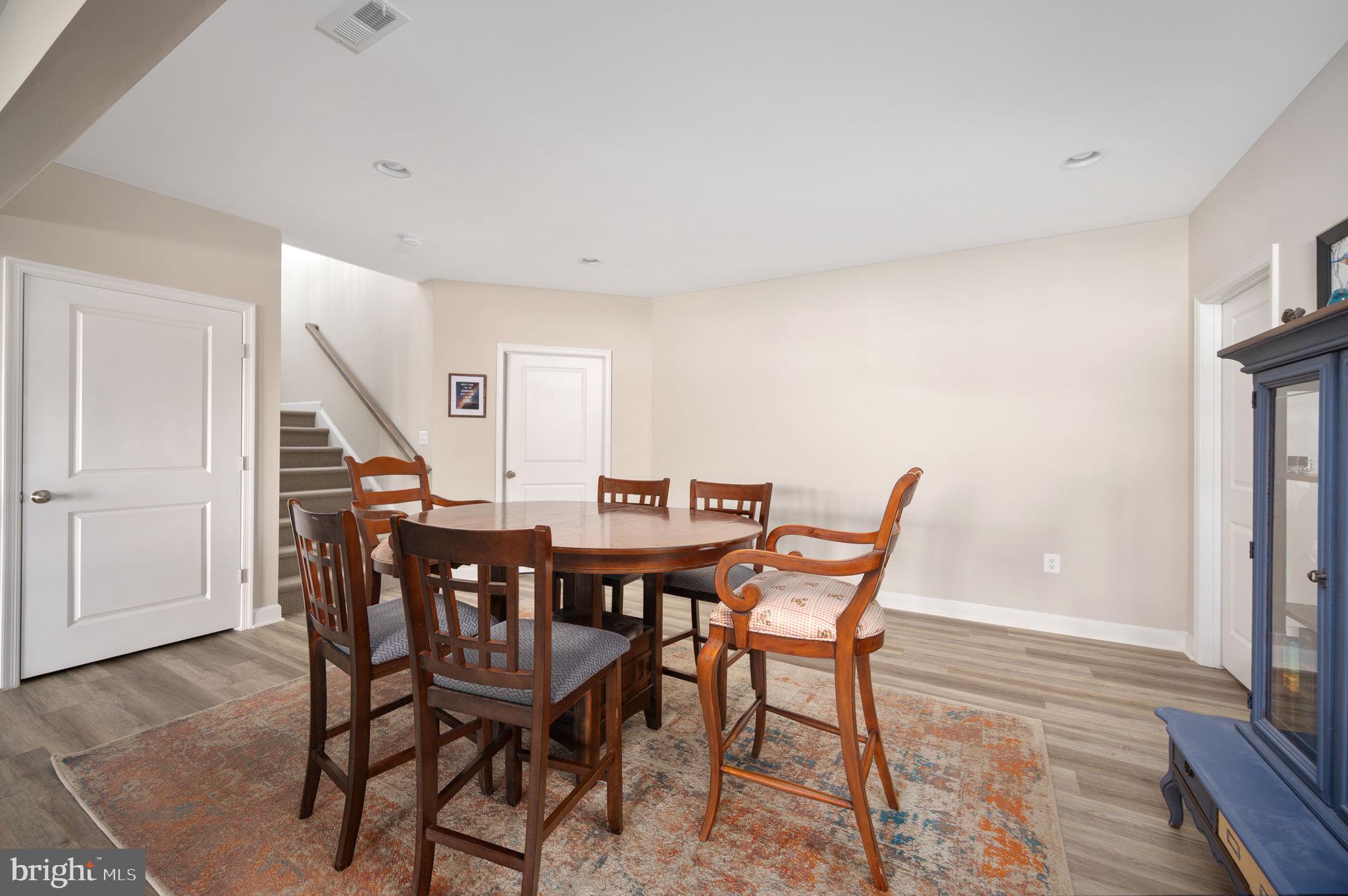 257 Rock Island Ridge Mineral, VA 23117 - Photo 89 of 128 a view of a dining room with furniture and wooden floor