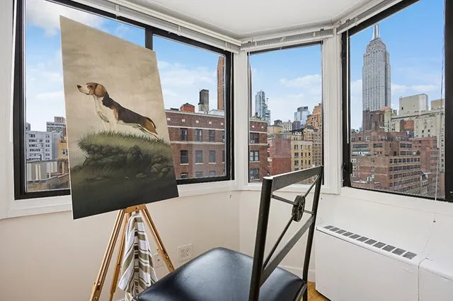 a view of a balcony with furniture
