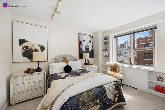 137 East 36th Street, Unit 11B Manhattan, NY 10016 - Photo 15 of 22 a bedroom with a bed and a window