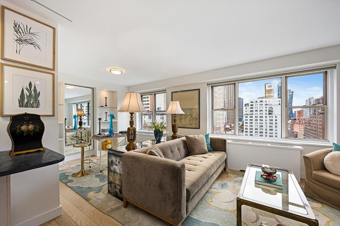 137 East 36th Street, Unit 11B Manhattan, NY 10016 - Photo 3 of 22 a living room with furniture and a large window