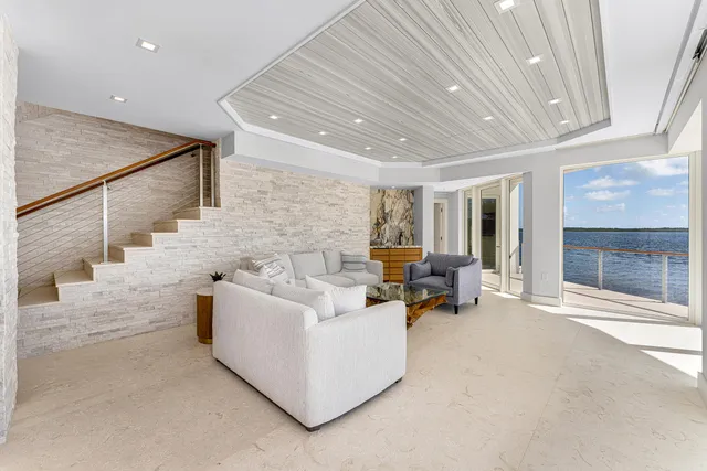a dining room with furniture and chandelier