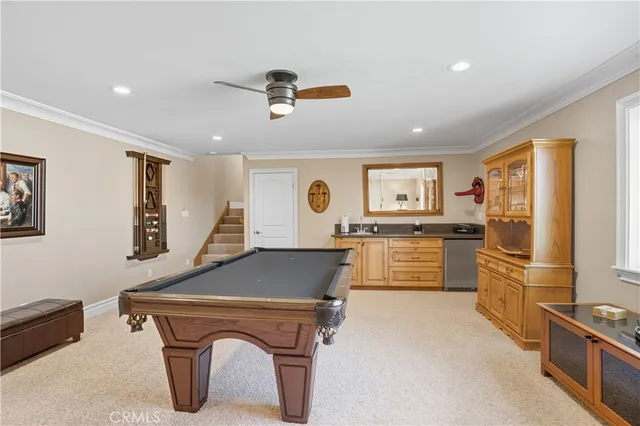 a utility room with sink dryer and washer