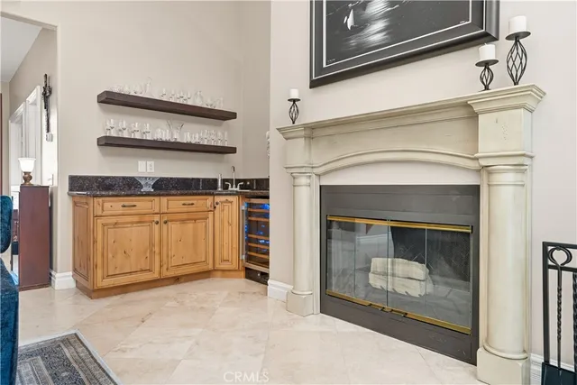 a bathroom with a granite countertop sink a toilet and shower
