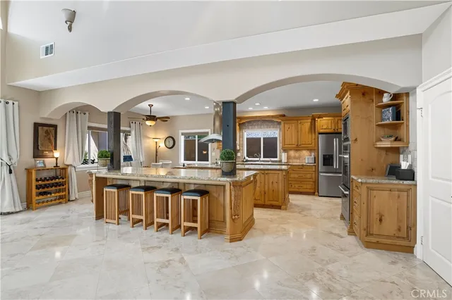 a en suite bathroom with a sink double vanity and a mirror
